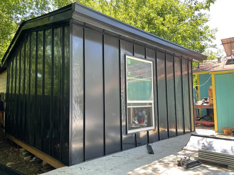 Black standing seam metal wall panels for Roof Inspection in Badger
