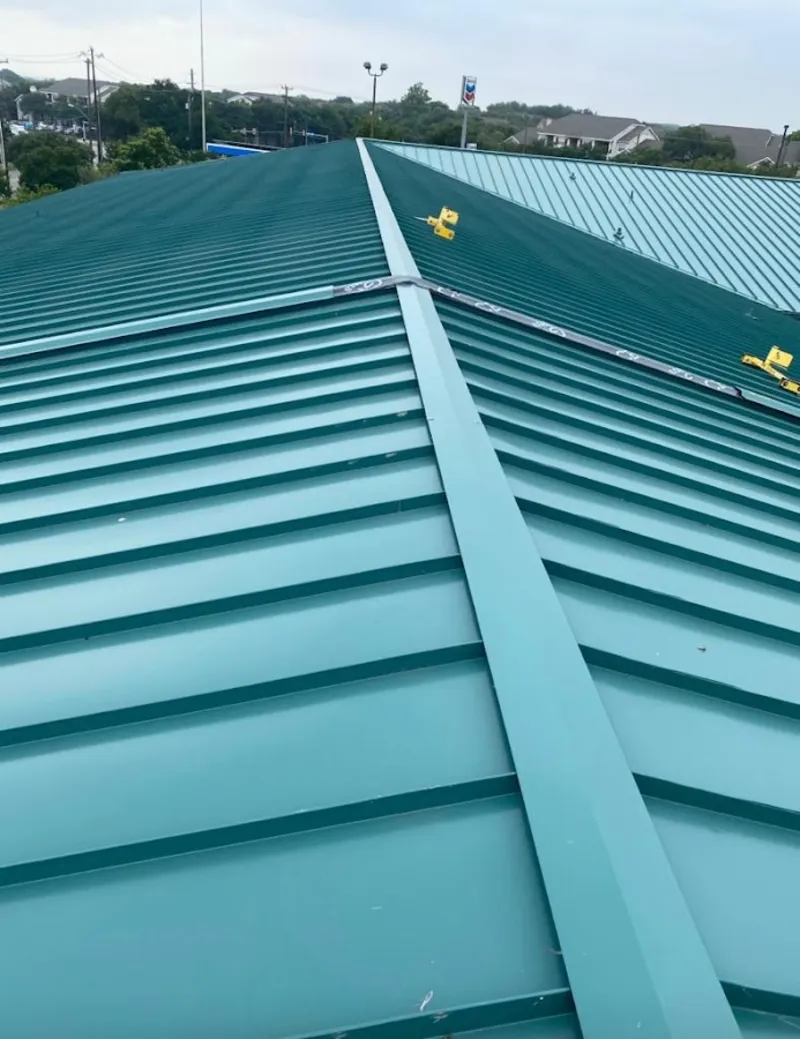 Green commercial metal roof ridge and valley for Metal Roof Repair in Badger