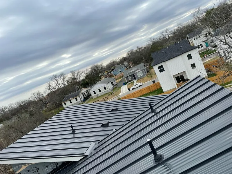 Standing seam metal roof panels with vents for Skylight Repair in Badger